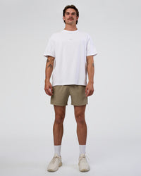 Man wearing Rep 5" Performance Short - Greige | Model:Konnor | Size:M
