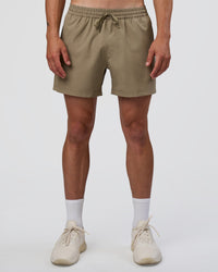 Man wearing Rep 5" Performance Short - Greige | Model:Konnor | Size:M