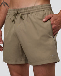 Man wearing Rep 5" Performance Short - Greige | Model:Konnor | Size:M
