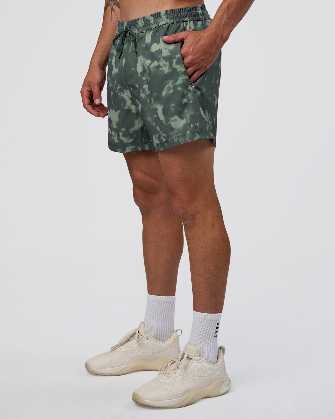 Man wearing Rep 5" Performance Short - Washed Camo Carbon | Model:Konnor | Size:M