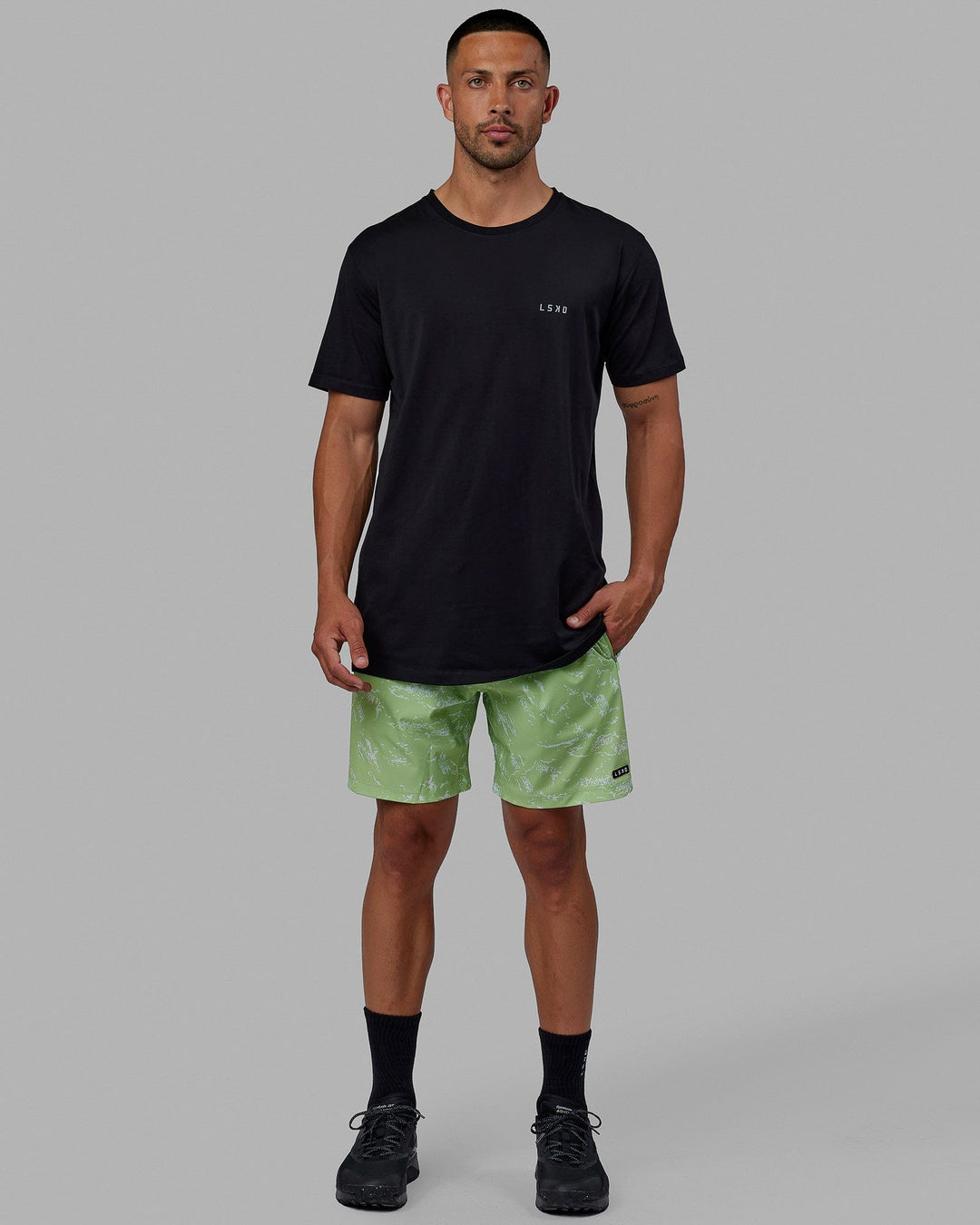 Man wearing Rep 7'' Performance Short - Terrain Green Fig