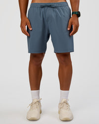 Man wearing Rep 7'' Performance Short - Blue Mirage | Model:George | Size:M