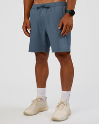 Man wearing Rep 7'' Performance Short - Blue Mirage | Model:George | Size:M