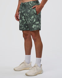 Man wearing Rep 7'' Performance Short - Washed Camo Carbon | Model:Konnor | Size:M