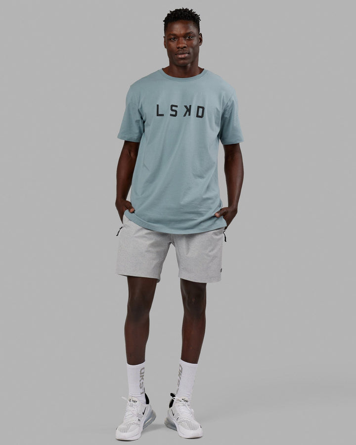 Man wearing Rep 7" Performance Short - Light Grey Marl