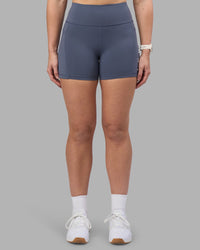 Woman wearing Rep Ultra High-Rise 4" Short Pockets - Night Shadow-White | Model:Amy | Size:M