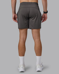 Man wearing Restore CloudFLX Short - Dark Storm | Model:Cameron | Size:M