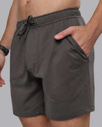 Man wearing Restore CloudFLX Short - Dark Storm | Model:Cameron | Size:M