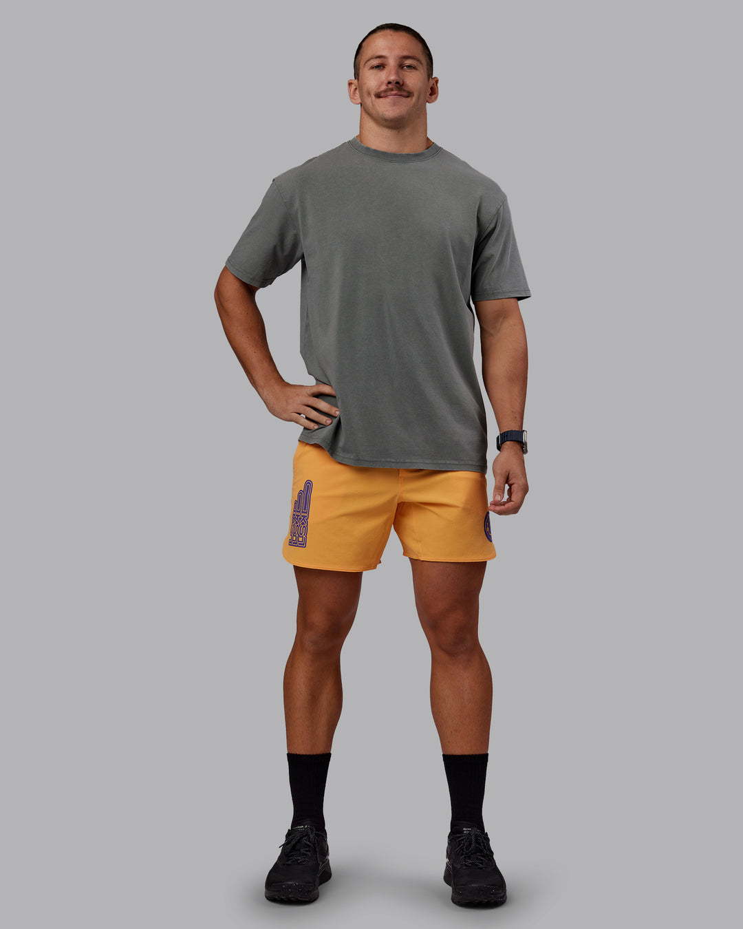 Man wearing Rise &amp; Lift Washed FLXCotton Oversized Tee - Graphite-Purple Opulence | Model:Jaiden | Size:M
