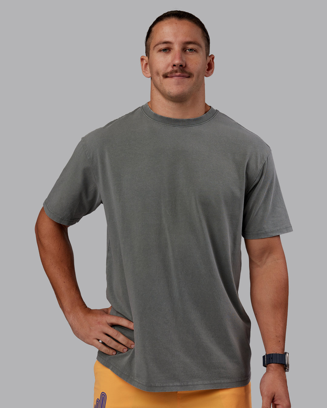 Man wearing Rise &amp; Lift Washed FLXCotton Oversized Tee - Graphite-Purple Opulence | Model:Jaiden | Size:M