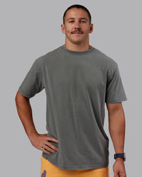 Man wearing Rise & Lift Washed FLXCotton Oversized Tee - Graphite-Purple Opulence | Model:Jaiden | Size:M