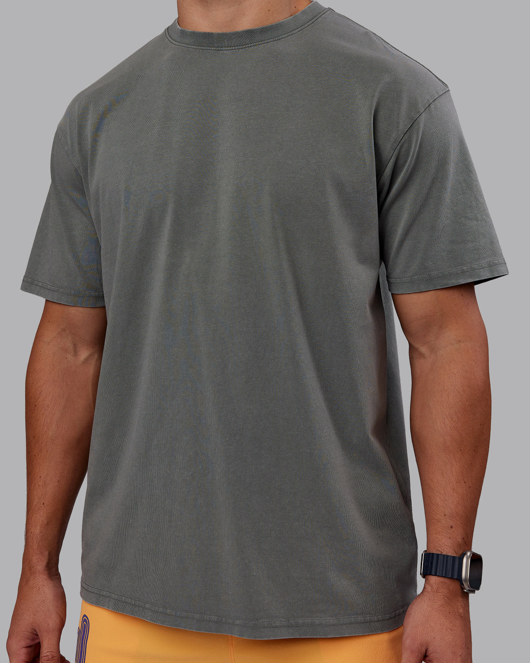 Man wearing Rise &amp; Lift Washed FLXCotton Oversized Tee - Graphite-Purple Opulence | Model:Jaiden | Size:M