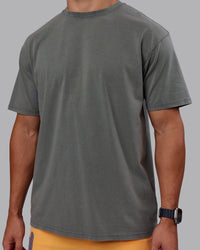 Man wearing Rise & Lift Washed FLXCotton Oversized Tee - Graphite-Purple Opulence | Model:Jaiden | Size:M