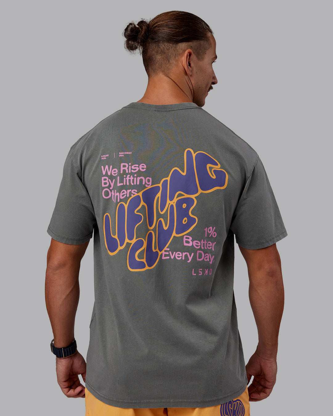 Man wearing Rise &amp; Lift Washed FLXCotton Oversized Tee - Graphite-Purple Opulence | Model:Jaiden | Size:M