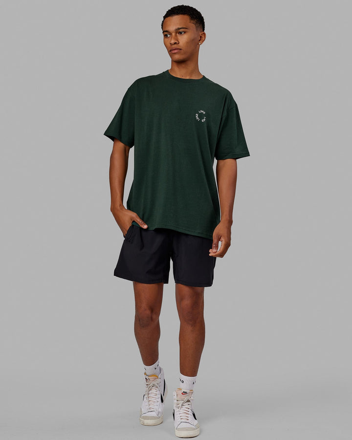 Man wearing Unisex Rotate Tee Oversize - Vital Green-White