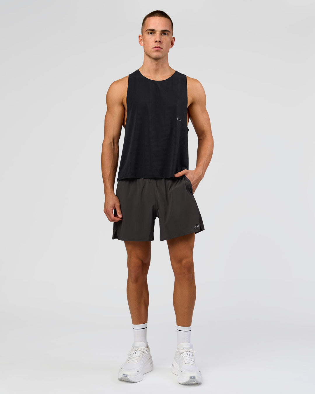 Man wearing Run Club Elevate Pace Running Tank - Black-Onyx | Model:Albert | Size:M