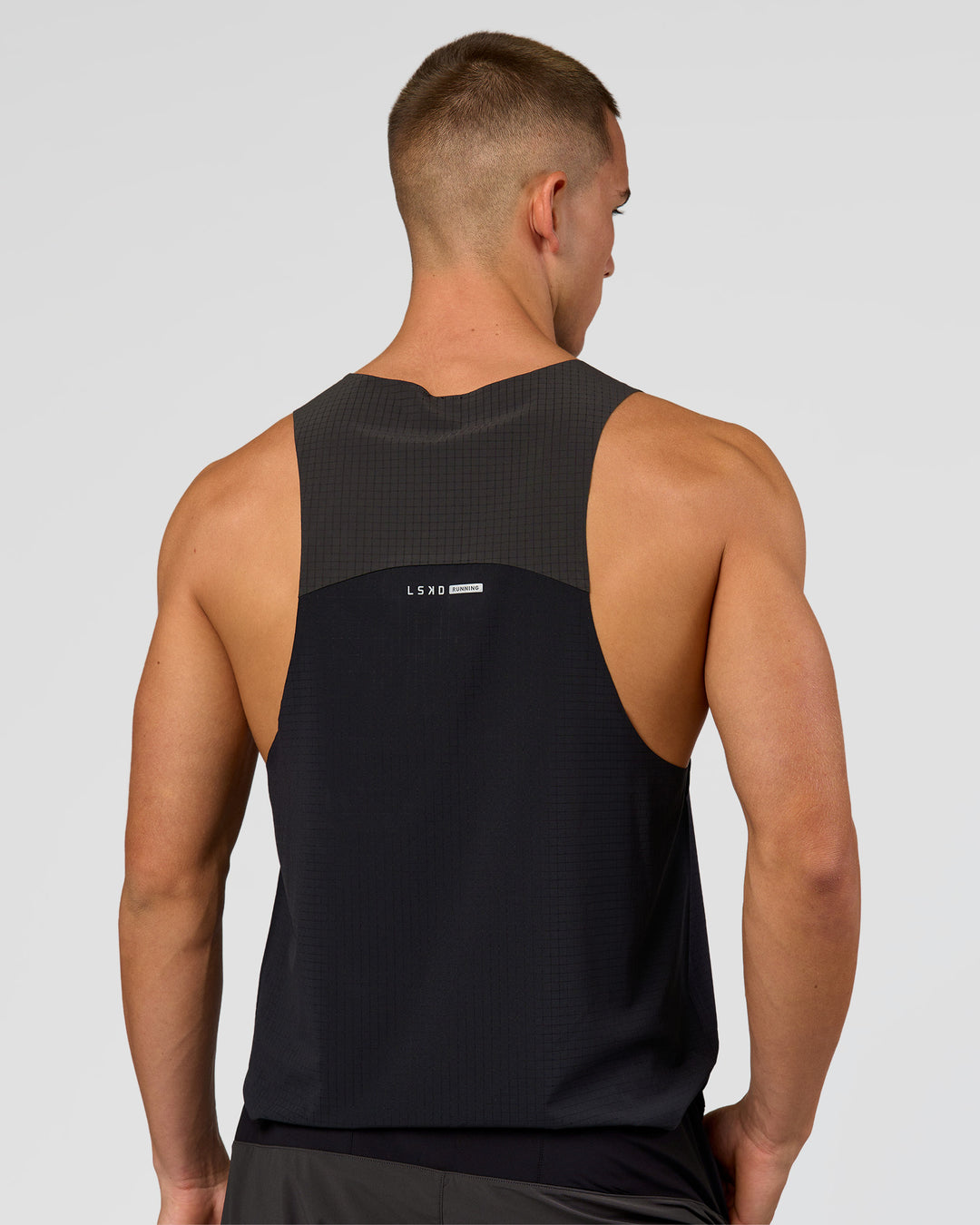 Man wearing Run Club Elevate Pace Running Tank - Black-Onyx | Model:Albert | Size:M