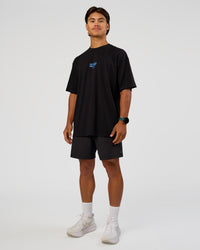 Man wearing Run Club Script FLXCotton Oversized Tee - Black-Palace Blue | Model:George | Size:M