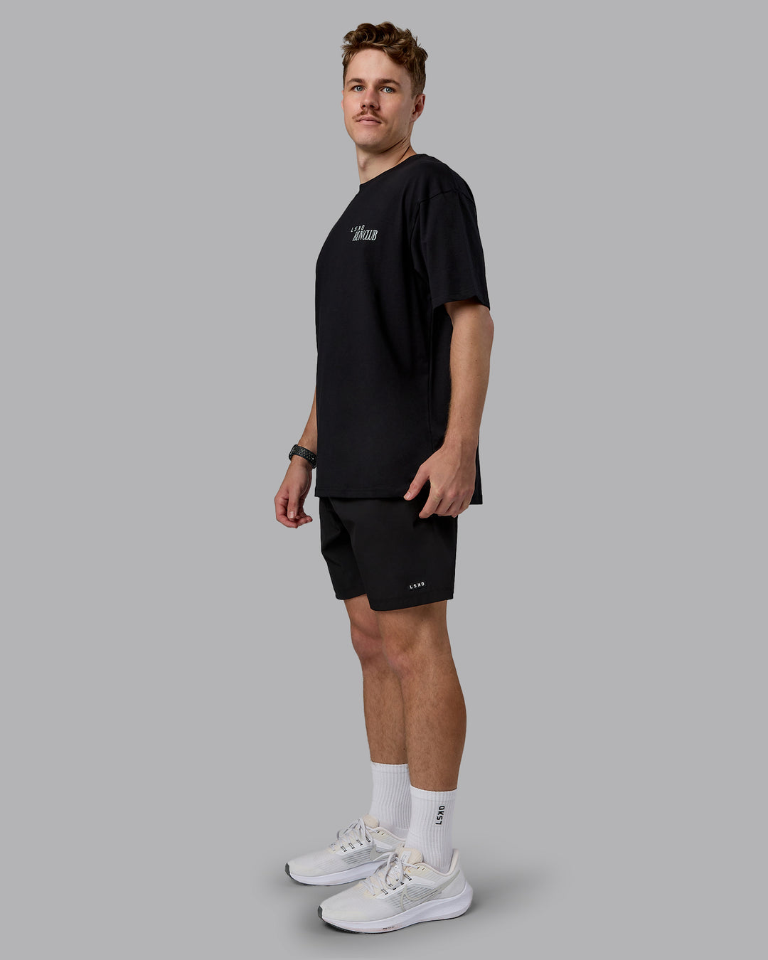 Man wearing Run Love FLXCotton Oversized Tee - Black-Reflective | Model:Cameron | Size:M
