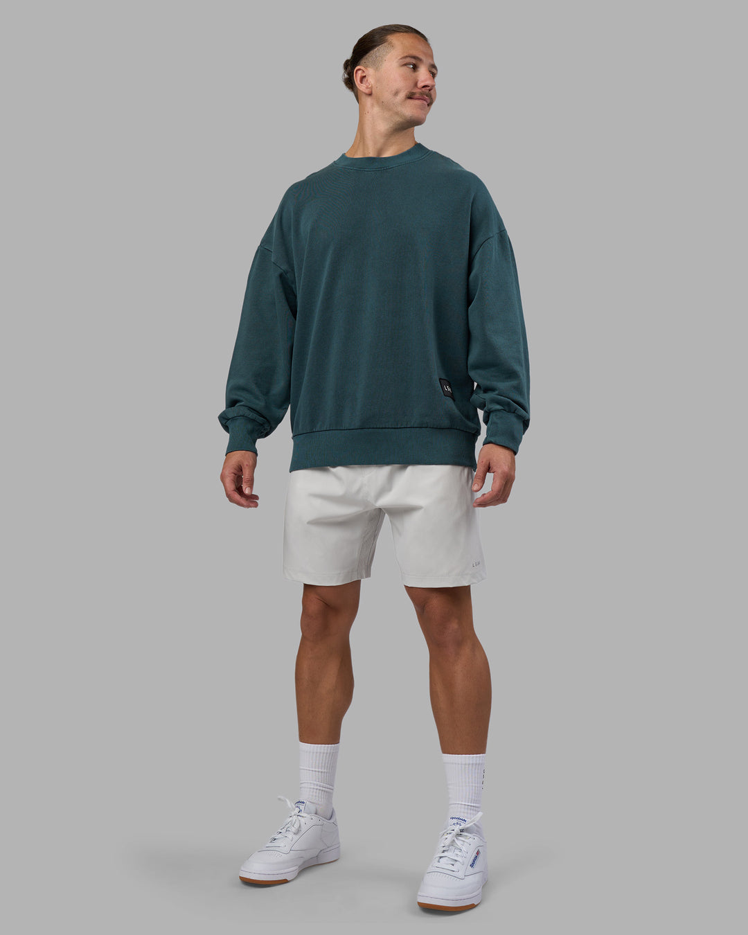 Man wearing Segmented Oversized Sweater - Abyssal | Model:Jaiden | Size:M