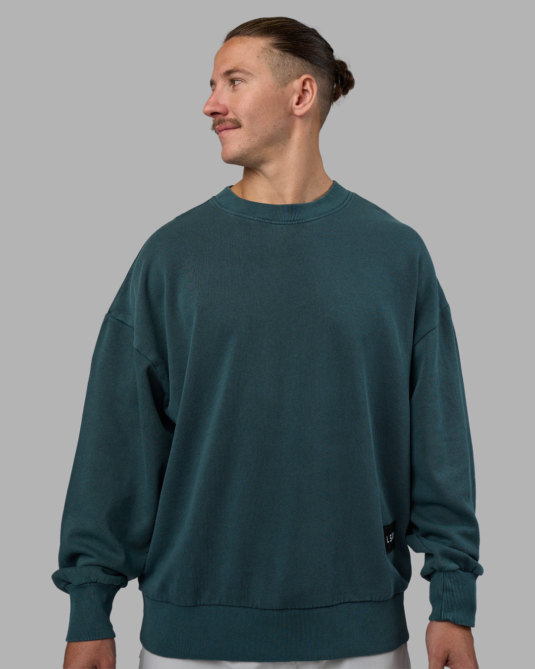 Man wearing Segmented Oversized Sweater - Abyssal | Model:Jaiden | Size:M