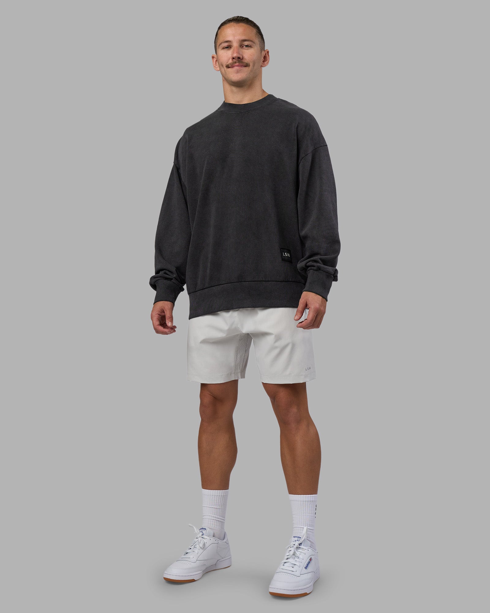 Man wearing Segmented Oversized Sweater - Black Washed | Model:Jaiden | Size:M