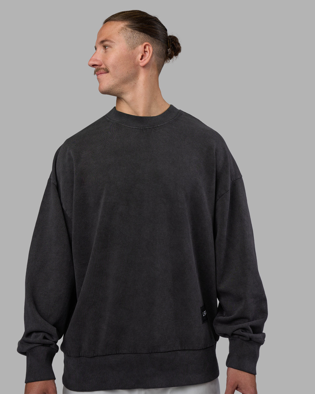 Man wearing Segmented Oversized Sweater - Black Washed | Model:Jaiden | Size:M