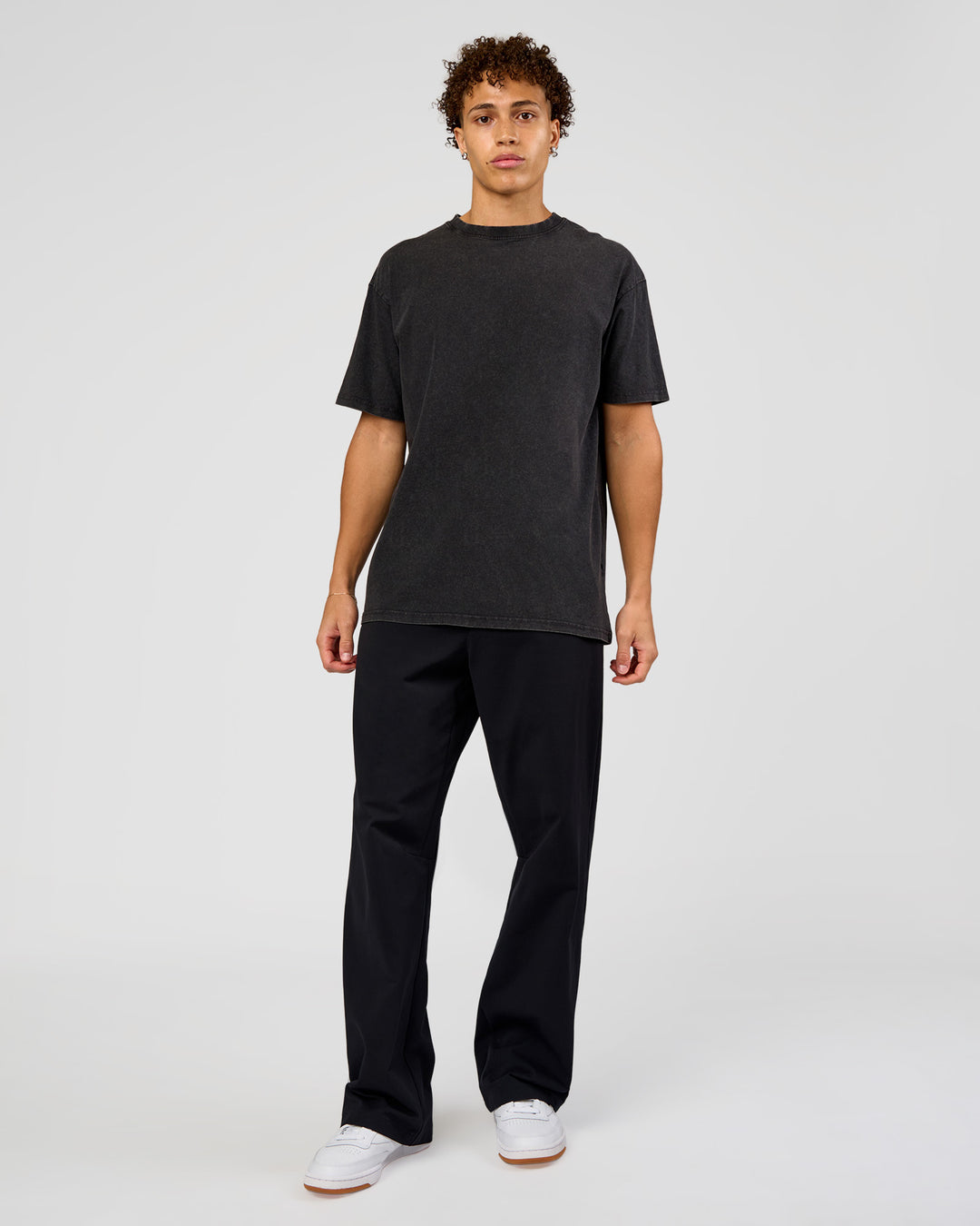 Man wearing Shadow Mode FLXCotton Oversized Tee - Black Washed | Model:Leandro | Size:M