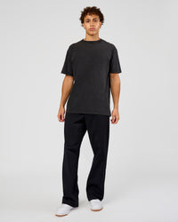 Man wearing Shadow Mode FLXCotton Oversized Tee - Black Washed | Model:Leandro | Size:M