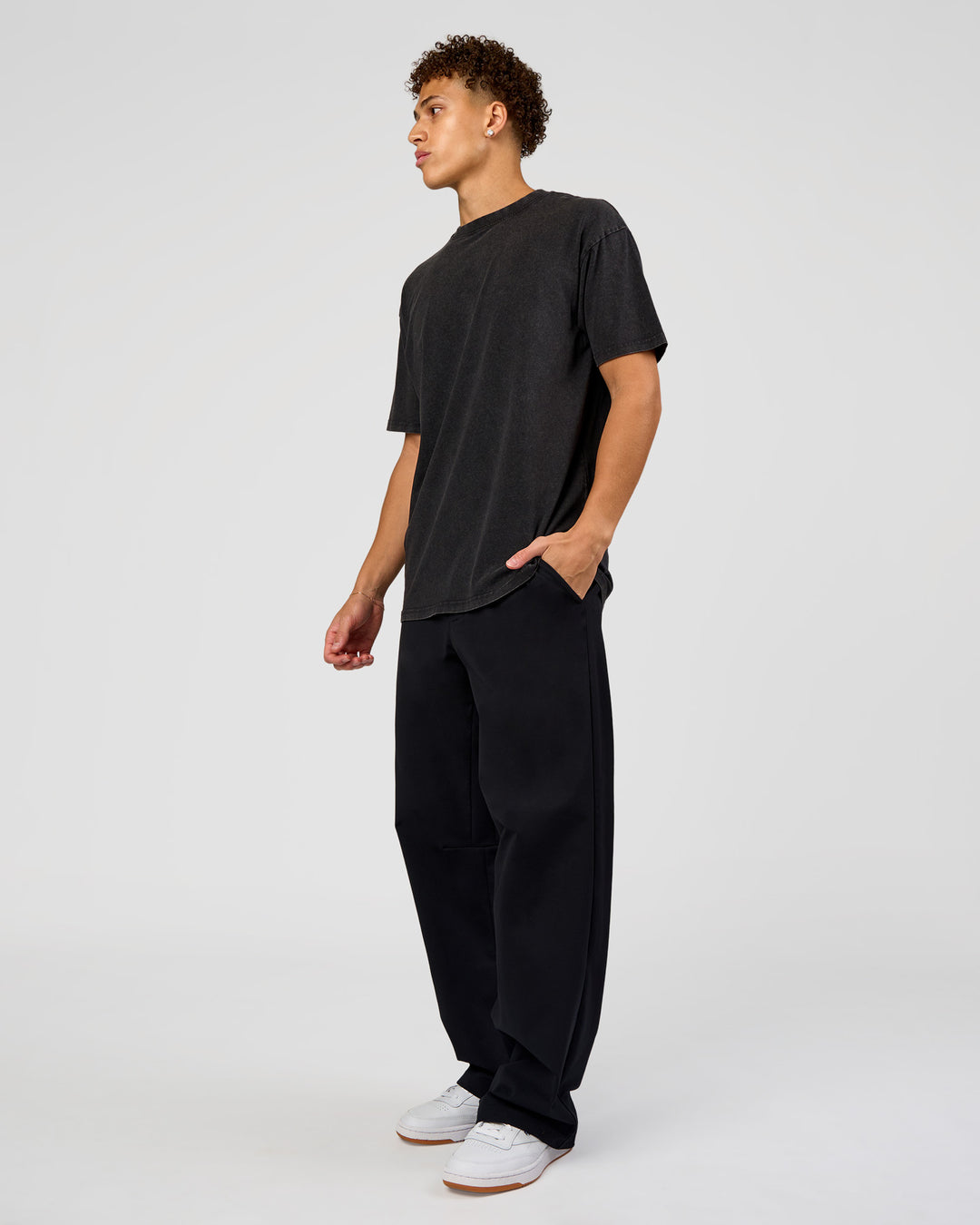 Man wearing Shadow Mode FLXCotton Oversized Tee - Black Washed | Model:Leandro | Size:M