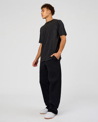 Man wearing Shadow Mode FLXCotton Oversized Tee - Black Washed | Model:Leandro | Size:M