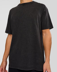 Man wearing Shadow Mode FLXCotton Oversized Tee - Black Washed | Model:Leandro | Size:M