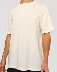 Man wearing Shadow Mode FLXCotton Oversized Tee - Off White Washed | Model:Leandro | Size:M