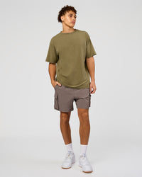 Man wearing Shadow Mode FLXCotton Oversized Tee - Walnut Grey Washed | Model:Leandro | Size:M