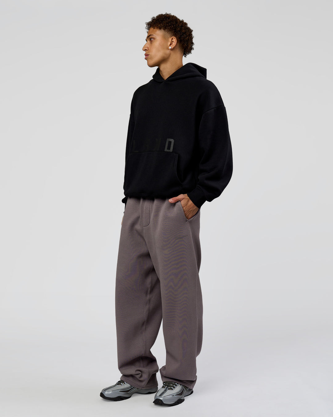 Man wearing Shadow Mode Oversized Hoodie - Black | Model:Leandro | Size:M