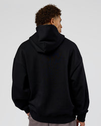 Man wearing Shadow Mode Oversized Hoodie - Black | Model:Leandro | Size:M