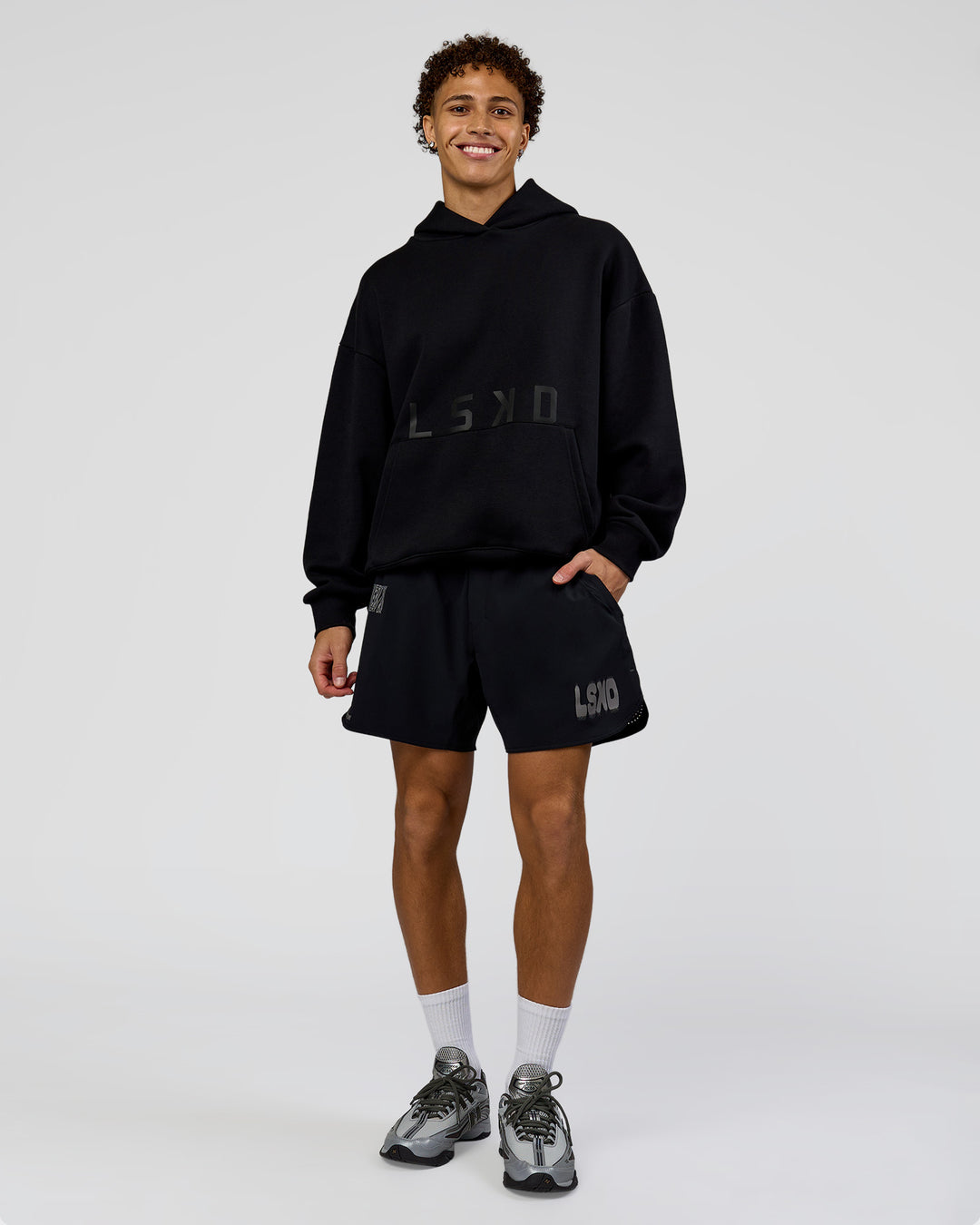 Man wearing Shadow Mode Oversized Hoodie - Black | Model:Leandro | Size:M