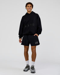 Man wearing Shadow Mode Oversized Hoodie - Black | Model:Leandro | Size:M