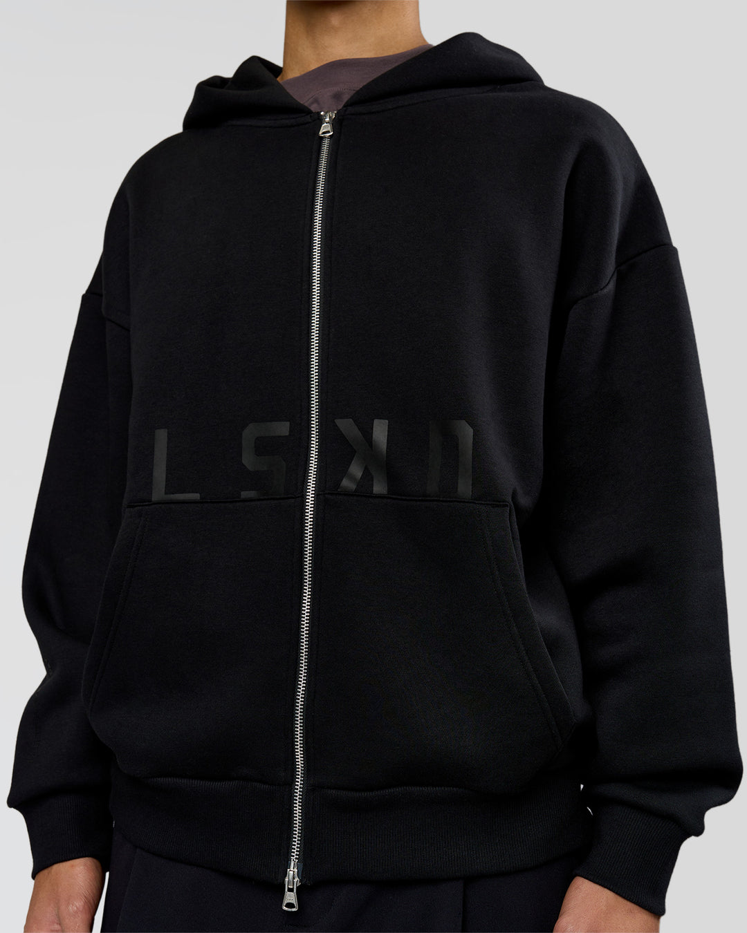 Man wearing Shadow Mode Oversized Zip Through Hoodie - Black | Model:Leandro | Size:M