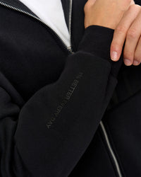 Man wearing Shadow Mode Oversized Zip Through Hoodie - Black | Model:Leandro | Size:M