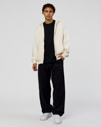 Man wearing Shadow Mode Oversized Zip Through Hoodie - Off White | Model:Leandro | Size:M