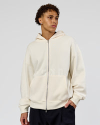 Man wearing Shadow Mode Oversized Zip Through Hoodie - Off White | Model:Leandro | Size:M