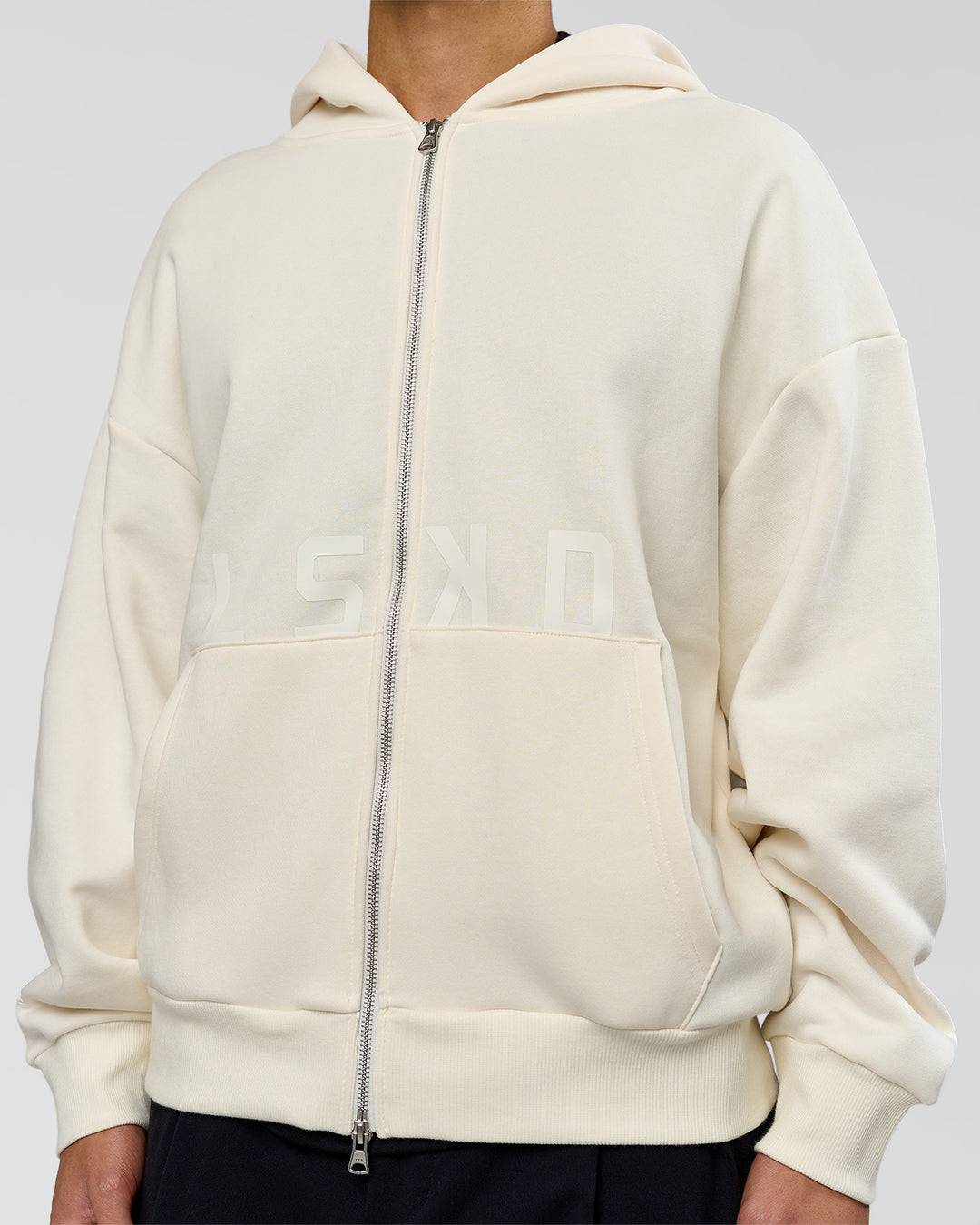 Man wearing Shadow Mode Oversized Zip Through Hoodie - Off White | Model:Leandro | Size:M