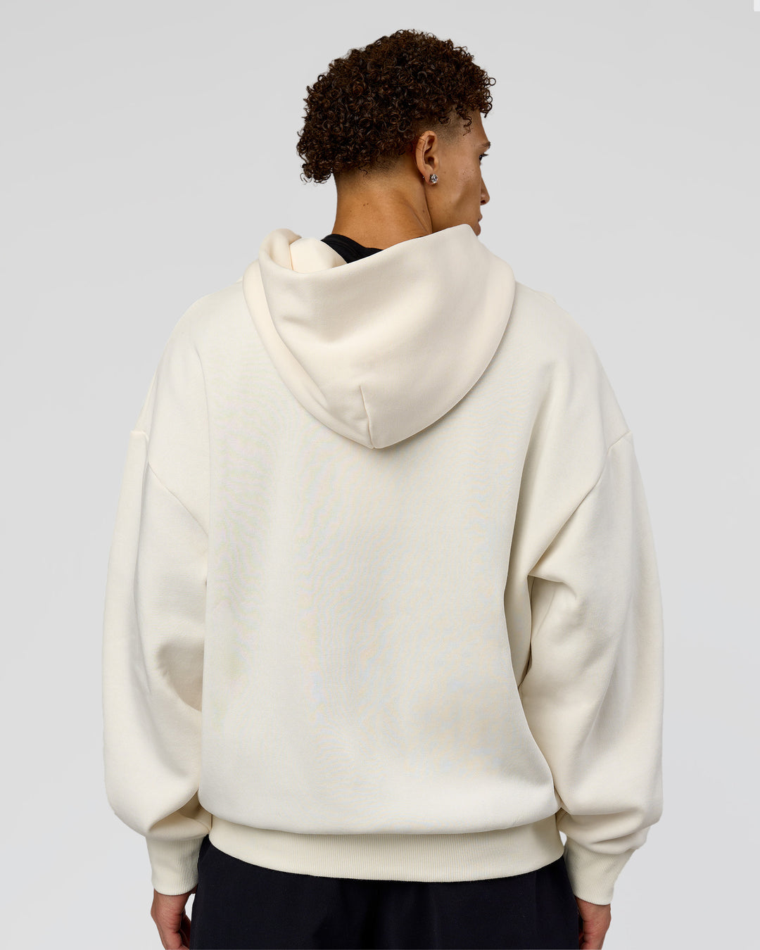 Man wearing Shadow Mode Oversized Zip Through Hoodie - Off White | Model:Leandro | Size:M
