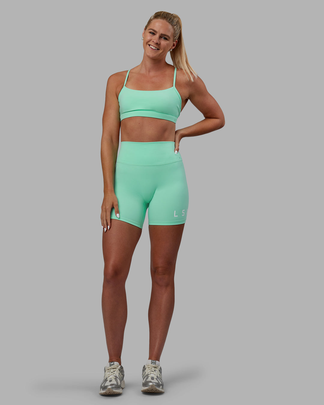 Woman wearing Shayna Jack Evolved Ultra High-Rise 6&quot; Short - Ice Green-White