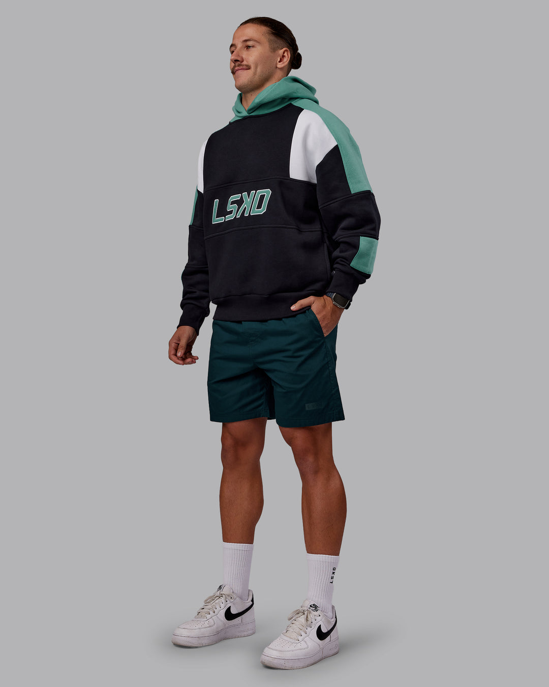Man wearing Slam Oversized Hoodie - Caviar-Agate Green | Model:Jaiden | Size:M