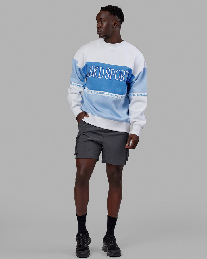 Man wearing Unisex Sportif Sweater Oversize - Windsurfer-Azure Blue