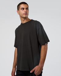 Man wearing Spray Heavyweight Unisex Oversized Tee - Charcoal Washed | Model:Zoran | Size:M