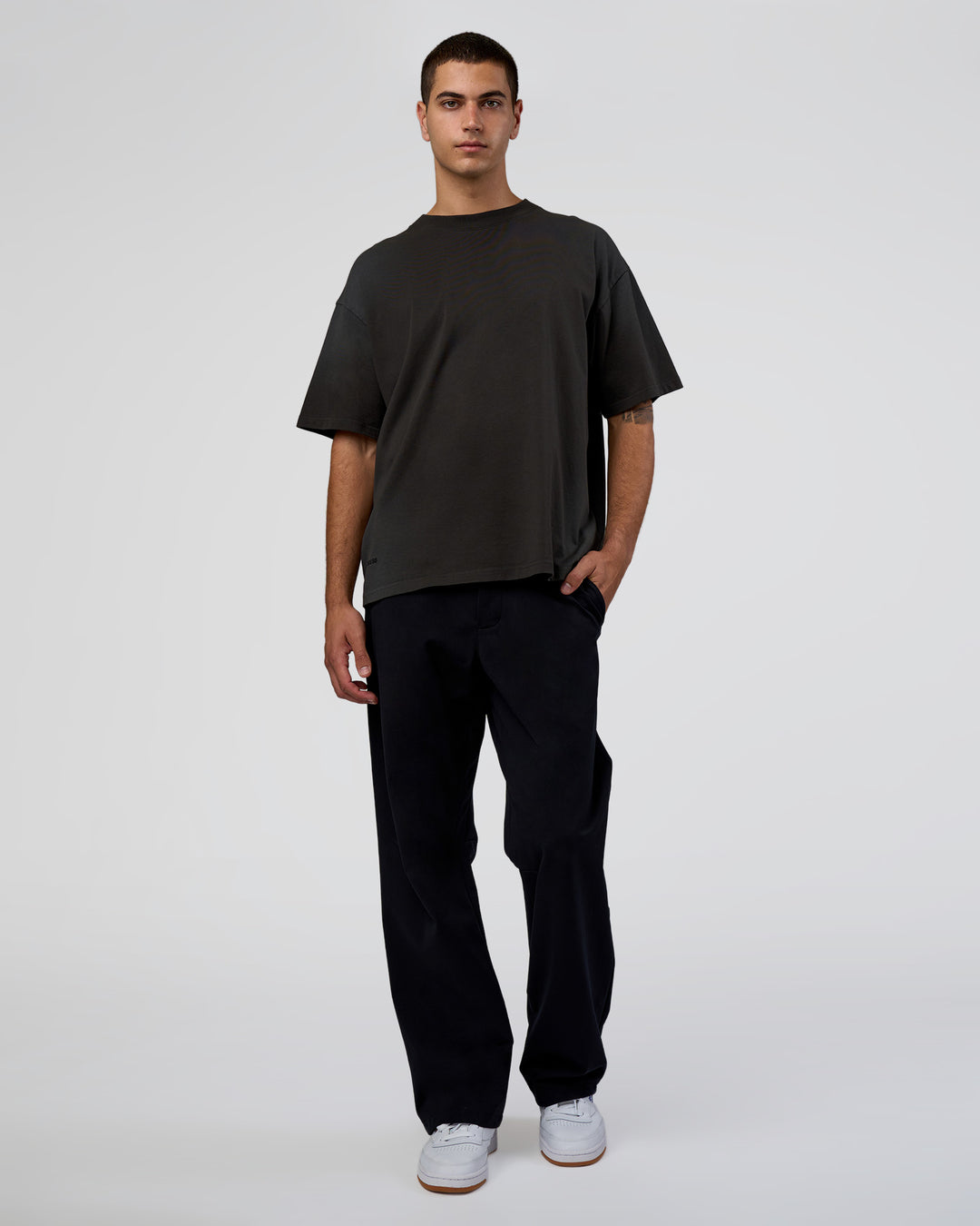 Man wearing Spray Heavyweight Unisex Oversized Tee - Charcoal Washed | Model:Zoran | Size:M