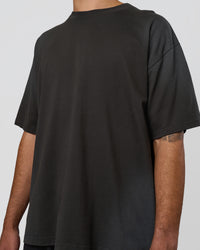 Man wearing Spray Heavyweight Unisex Oversized Tee - Charcoal Washed | Model:Zoran | Size:M